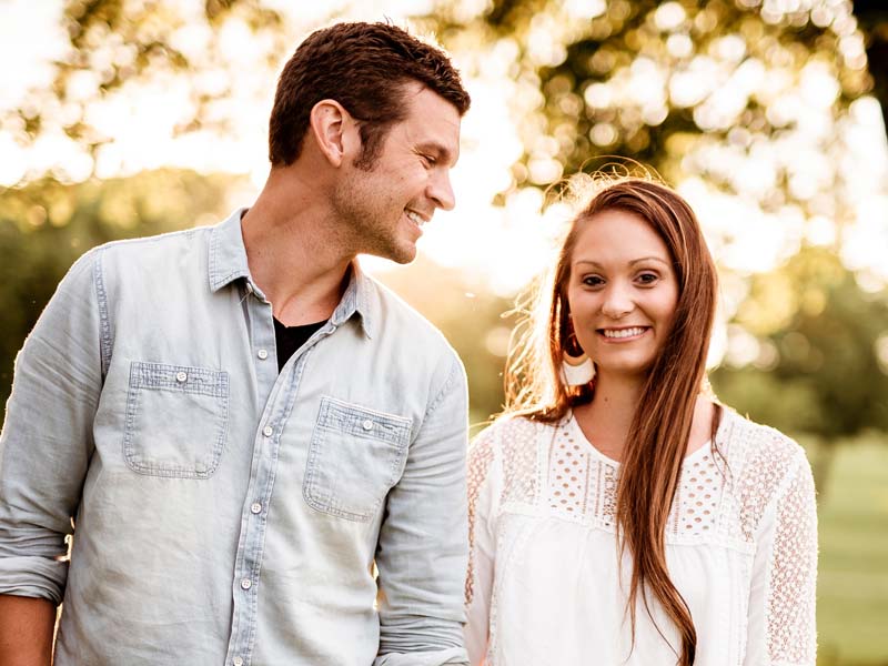 clear aligners couple smiling at one another